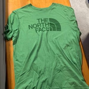 Green north face shirt
